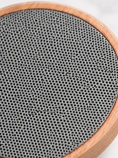 Round wooden Bluetooth speaker: Part close-up